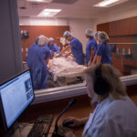Nursing students working in a sim lab