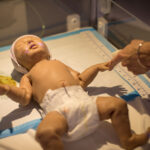 a baby nursing mannikin